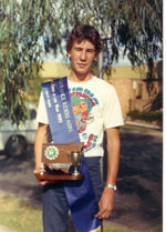 Bruce Neal holding a trophy for junior rider of the year 1985 - click to see larger photo